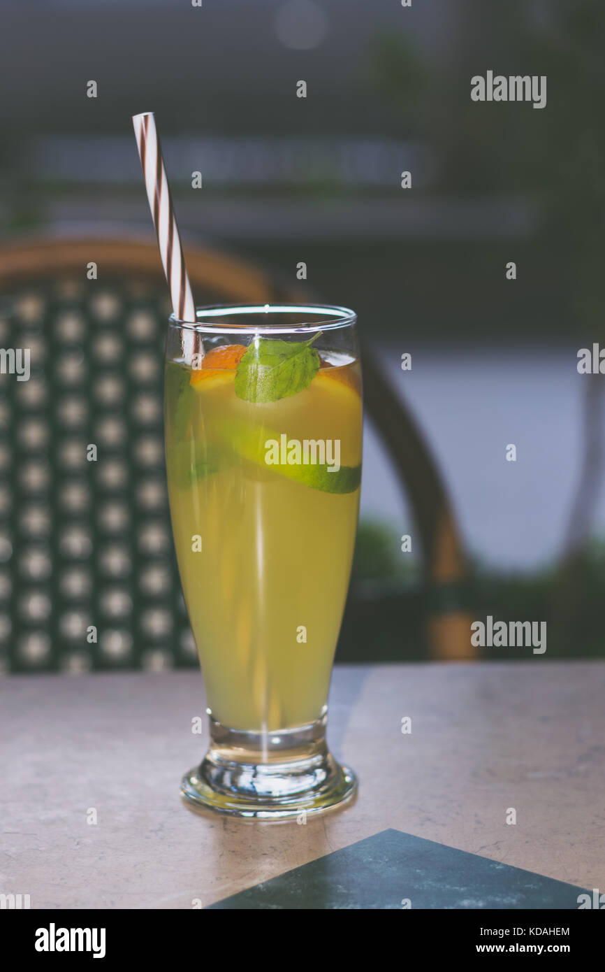 Lemonade Tall Glass With Lime And Orange Slices Mint Leaves
