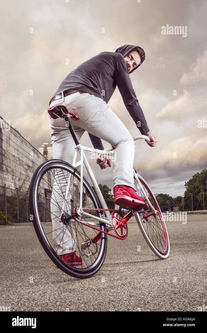 Man on a modern single speed bicycle Stock Photo