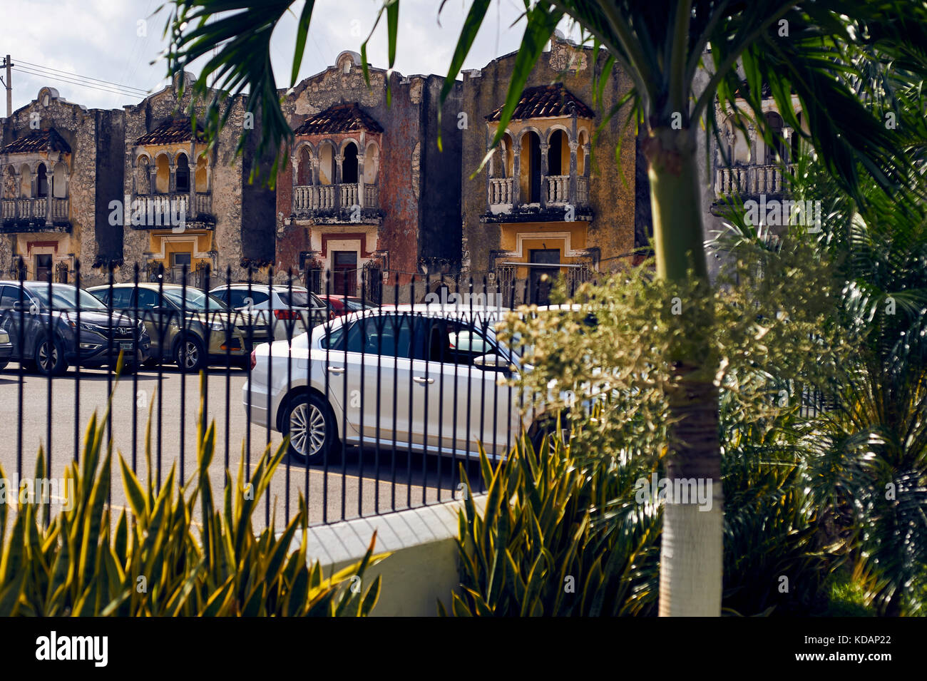 Old houses facades on parking lot by Paseo de Montejo avenue in Merida, Yucatan, Mexico Stock Photo