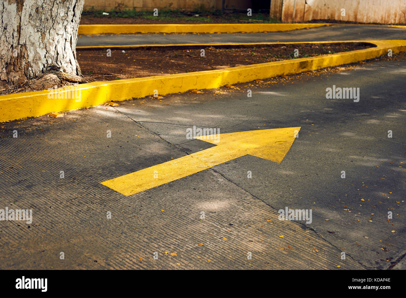 Parking lot entrance yellow arrow sign on Paseo de Montejo avenue in Merida, Mexico Stock Photo