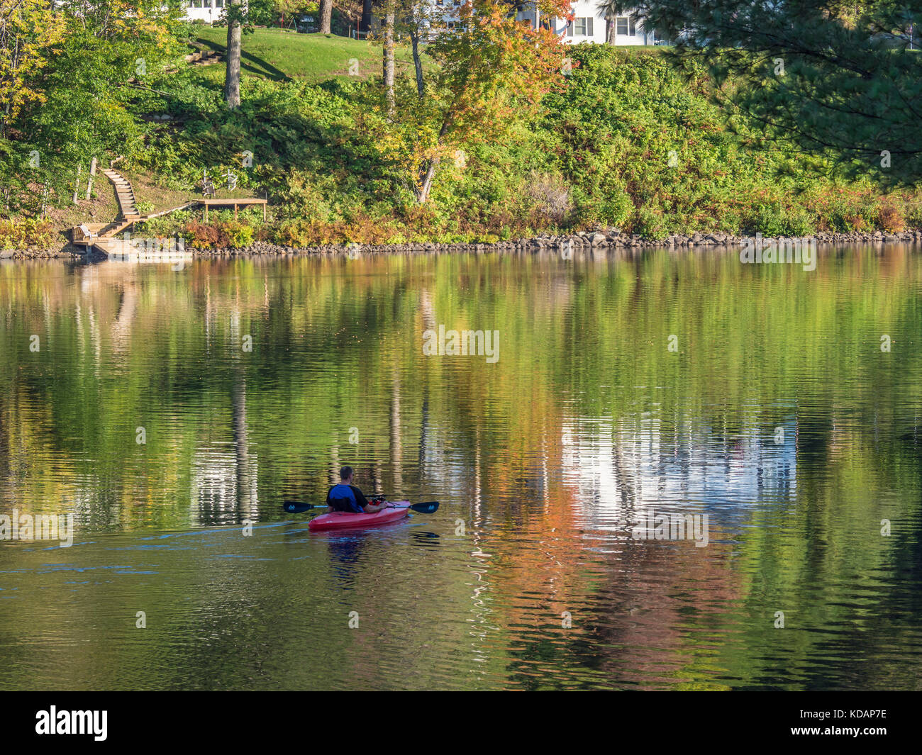 Man kayaks on Echo Lake north of Tyson, Vermont Stock Photo Alamy