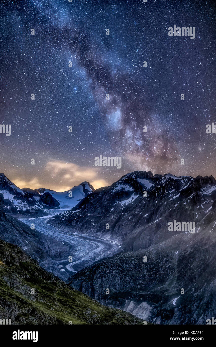 Milky way over the mountains at night, Switzerland Stock Photo