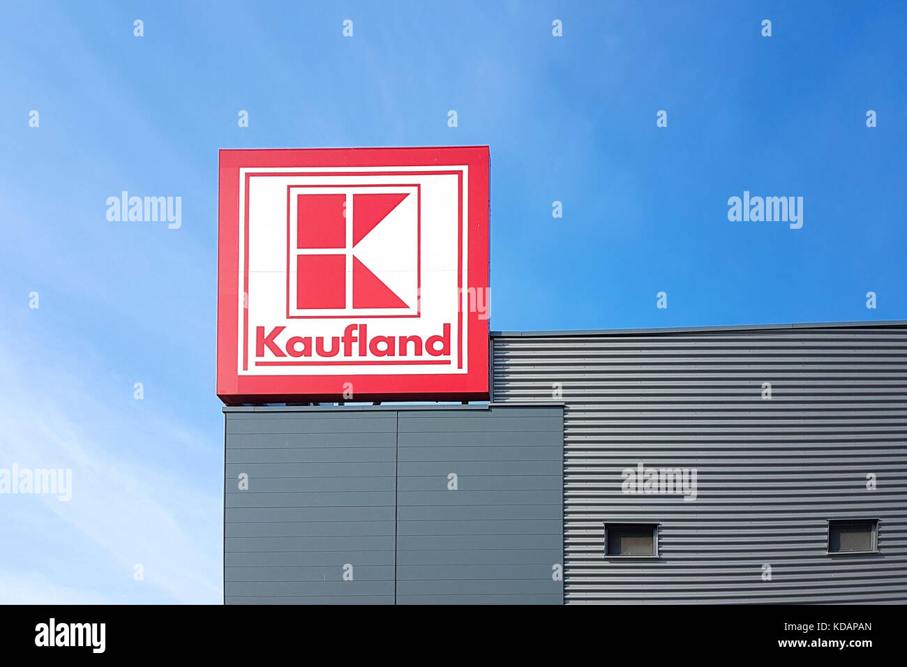 Gorlice, Poland - 30 September 2017: Sign of the Kaufland hypermarket on the blue sky in a sunny day. Kaufland is a German international distribution  Stock Photo