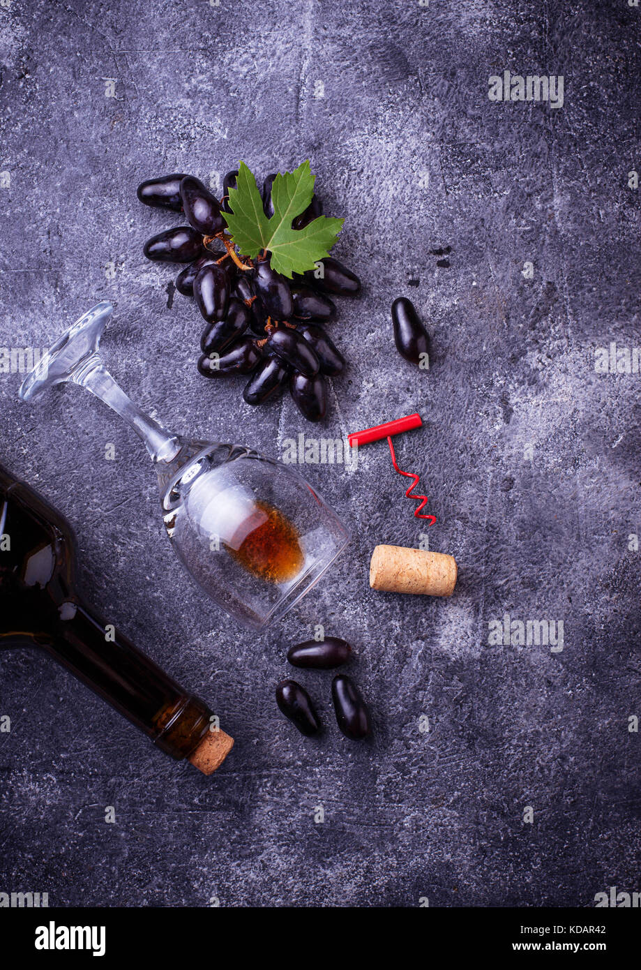 Grapes, red wine, glass, corkscrews and cork Stock Photo