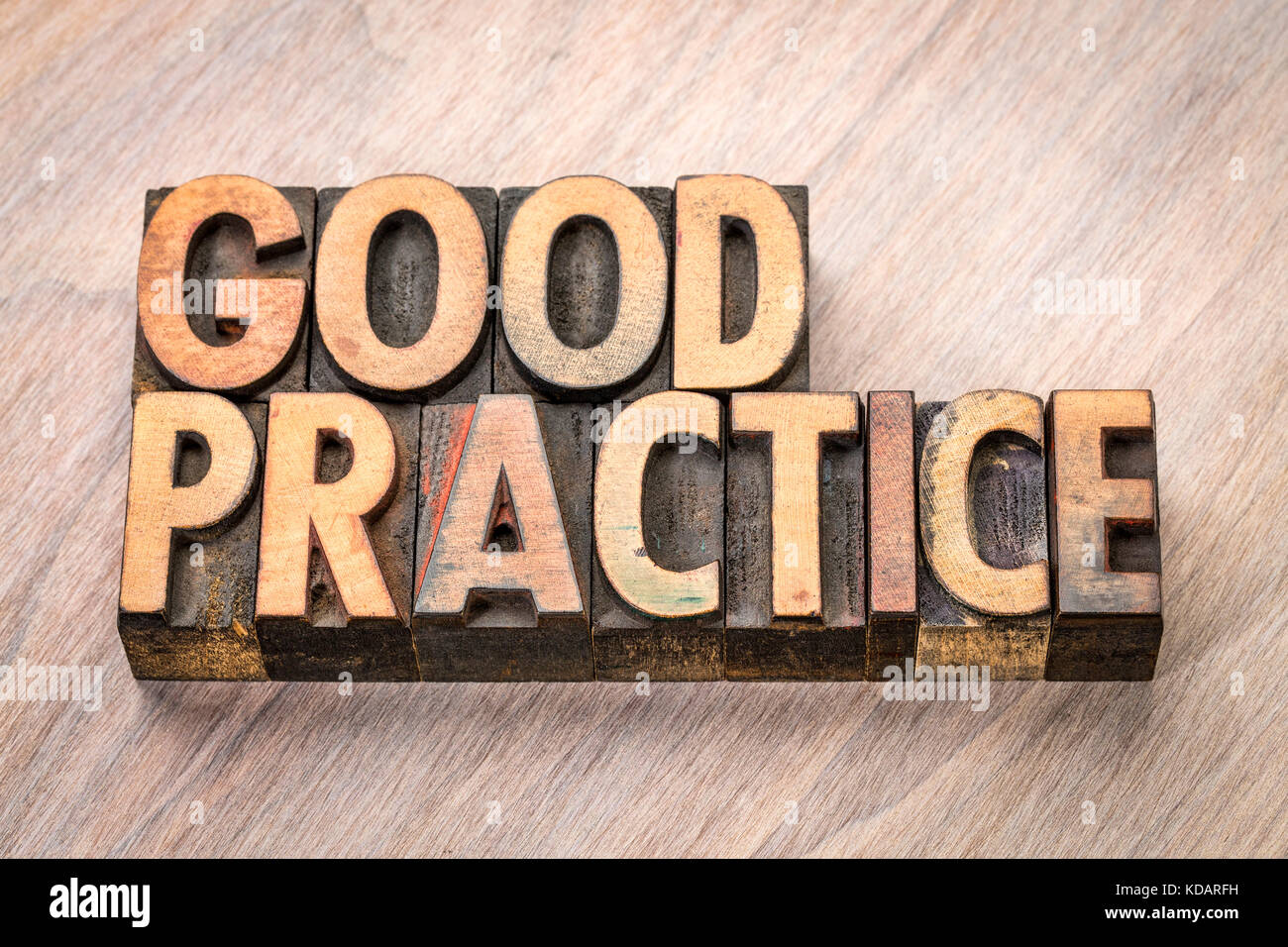 good practice word abstract in vintage letterpress wood type Stock Photo