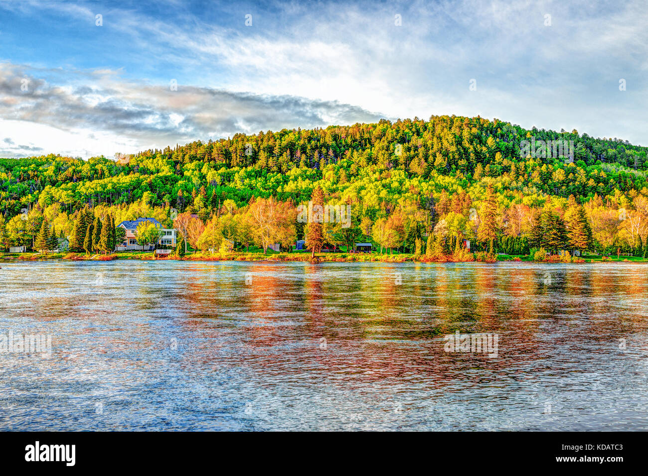 Chicoutimi river in Saguenay, Quebec, Canada with riverfront houses and