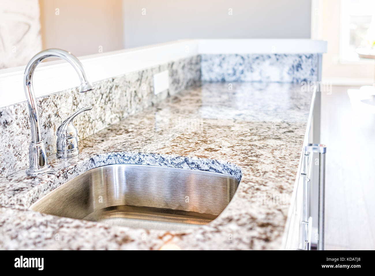 New Modern Faucet And Kitchen Sink Closeup With Granite