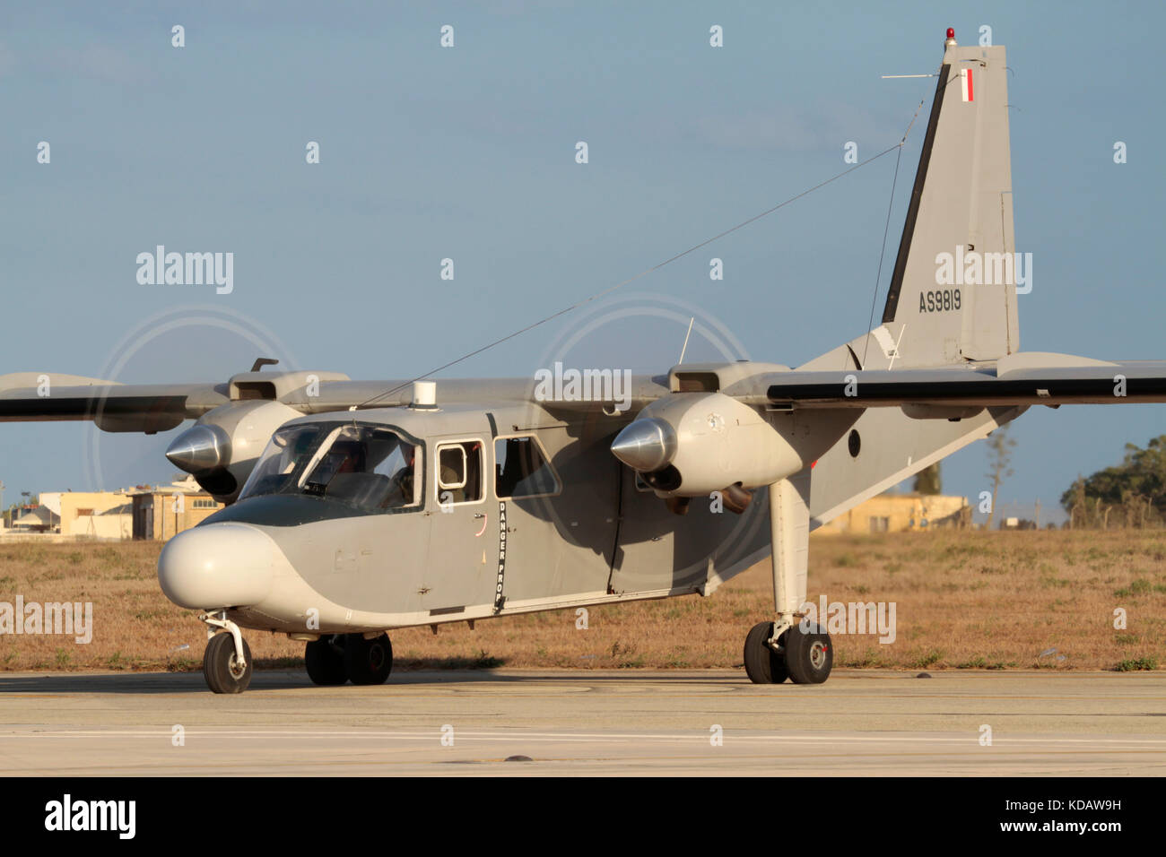 Britten-Norman Islander twin engine propeller powered maritime patrol aircraft of the Armed Forces of Malta starting up with props spinning Stock Photo