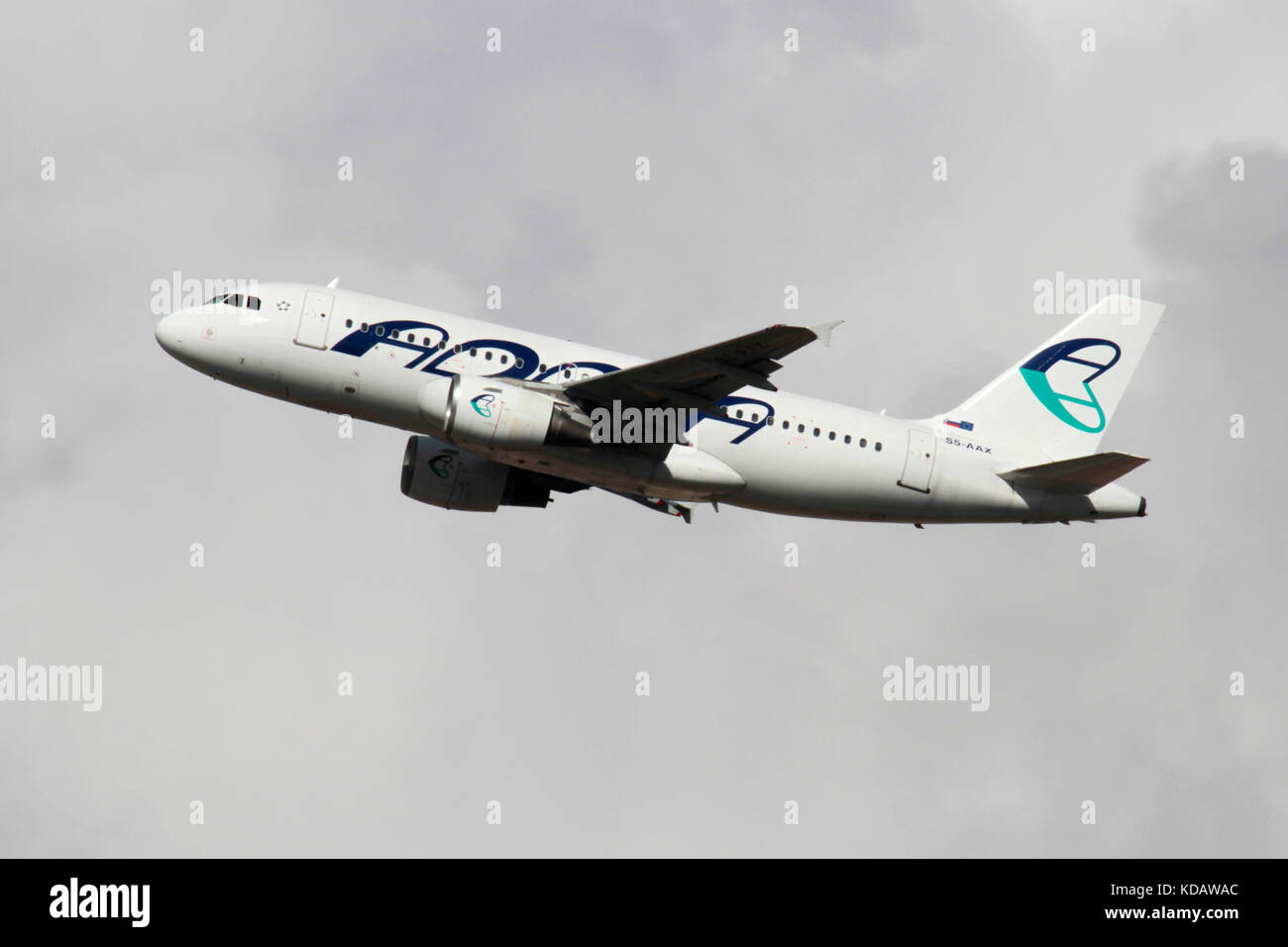 Adria Airways Airbus A319 in flight against a cloudy sky Stock Photo
