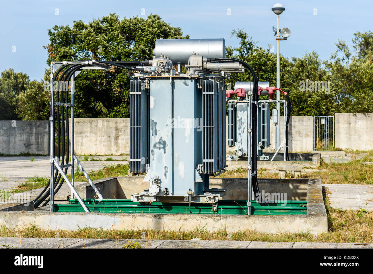 Old high voltage electric transformer power station. Industrial