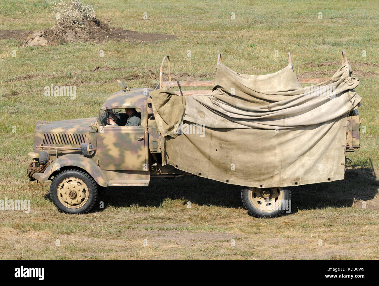 World War II era army truck in a field Stock Photo