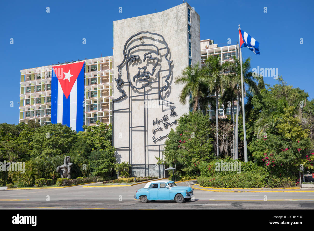 Plaza de la Revolucion in Havana, Cuba, with Cuban flag and artwork of Che Guevara and vintage car. Stock Photo