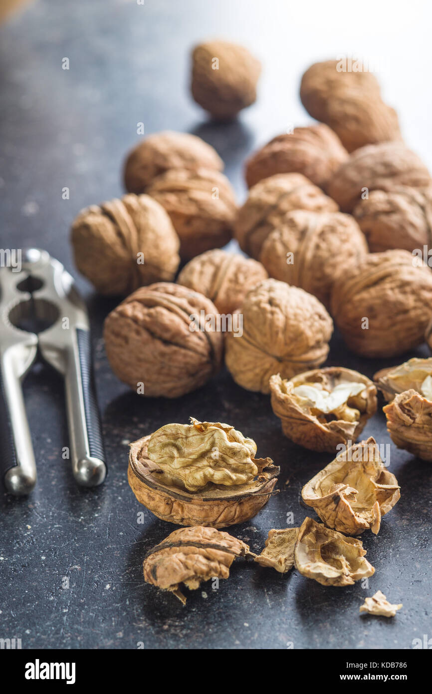 Tasty dried walnuts with nutcracker. Stock Photo