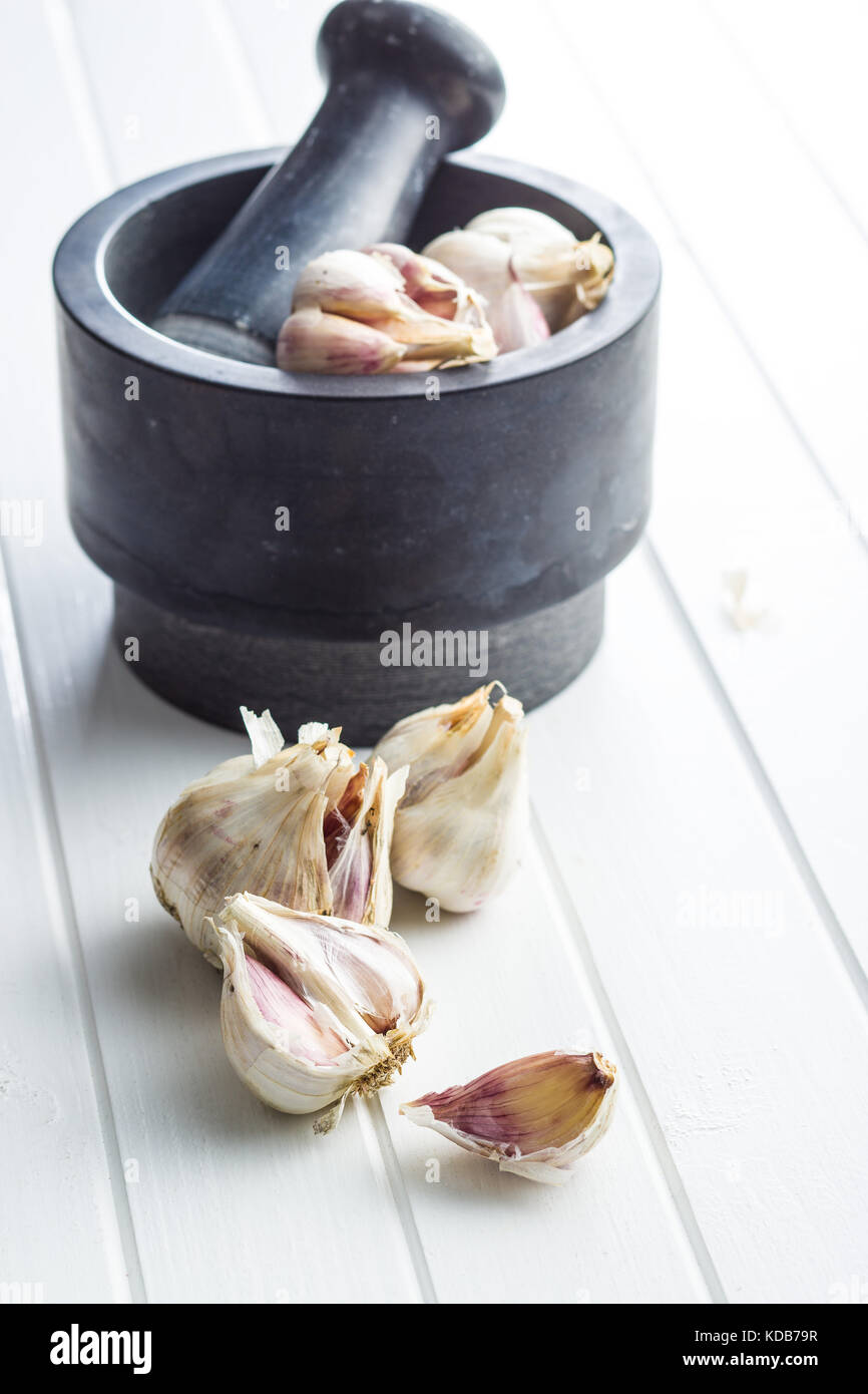 Fresh healthy garlic on white table Stock Photo - Alamy