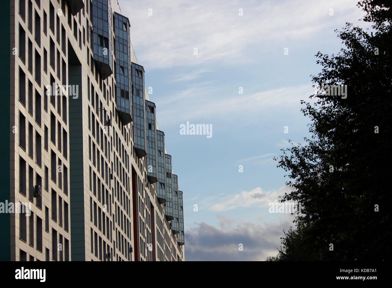 windows office building and trees against the blue sky Stock Photo - Alamy