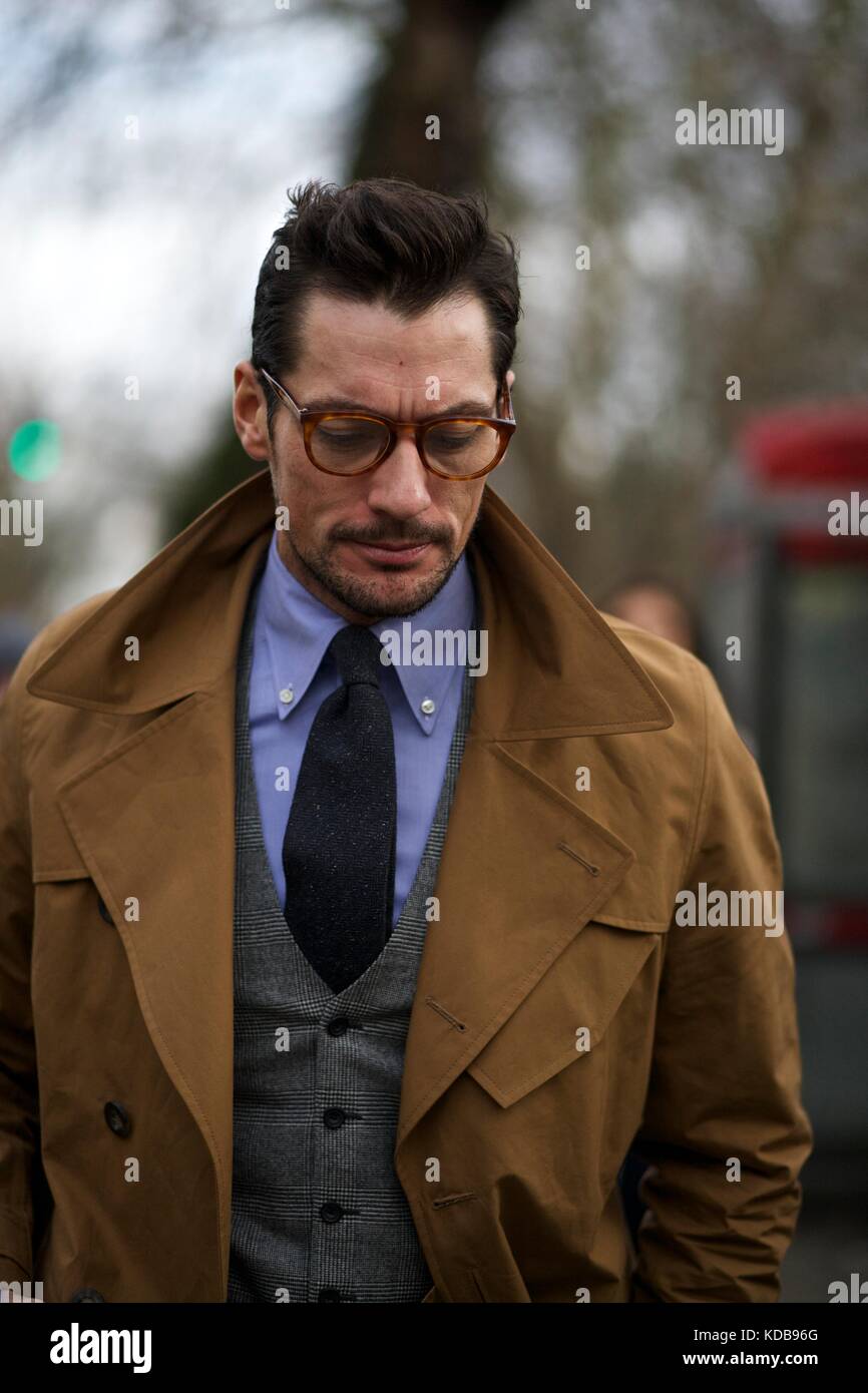 David Gandy wearing spectacles and a trench coat during Mens Fashion Week . London  Jan 2016 Street Style ***for editorial use only*** Stock Photo