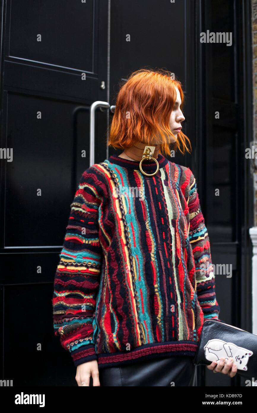 Fashionable woman poses in front of outside door during London Fashion Week 2016 street style ***for editorial use only*** Stock Photo