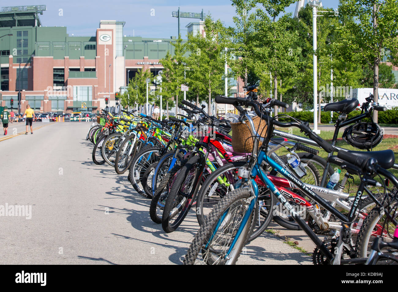 Green Bay, WI - August 1, 2017:  Bicycles lined up near Lambeau Field, placed there by local kids who hope a Packer player will ride their bike from t Stock Photo