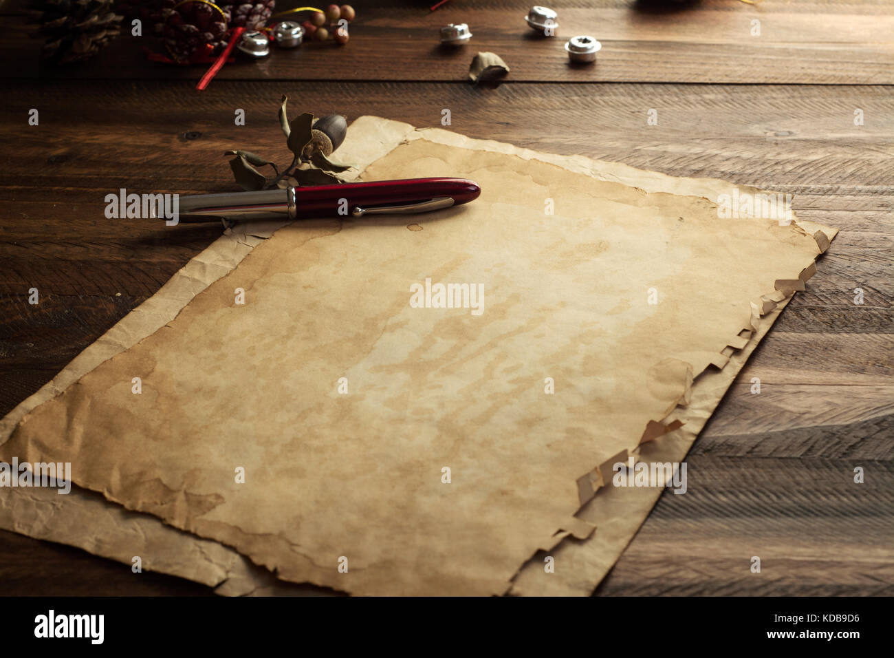 Ancient Christmas card, paper on rustic wood Stock Photo