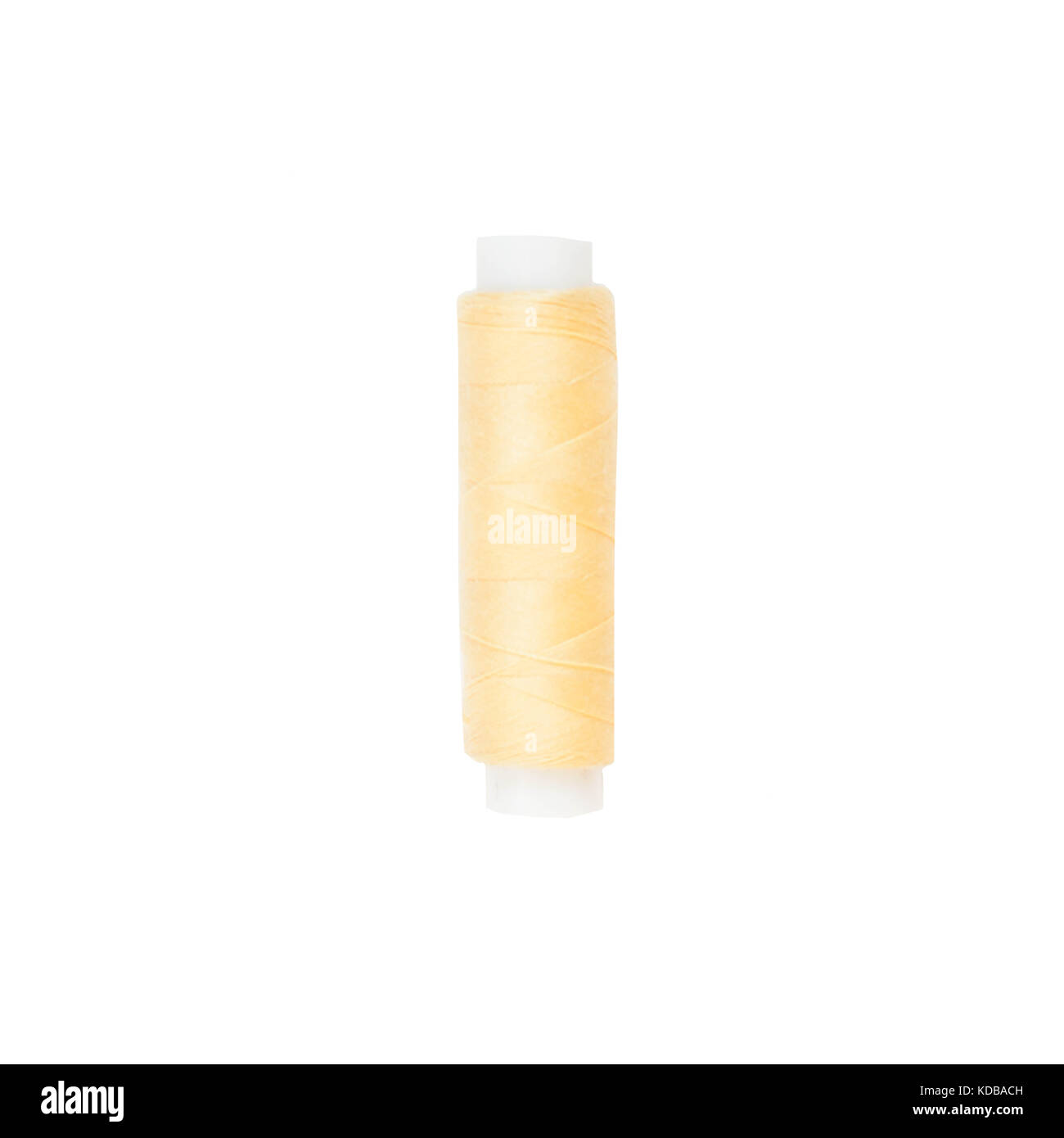 The coil with yellow threads. White background Stock Photo - Alamy