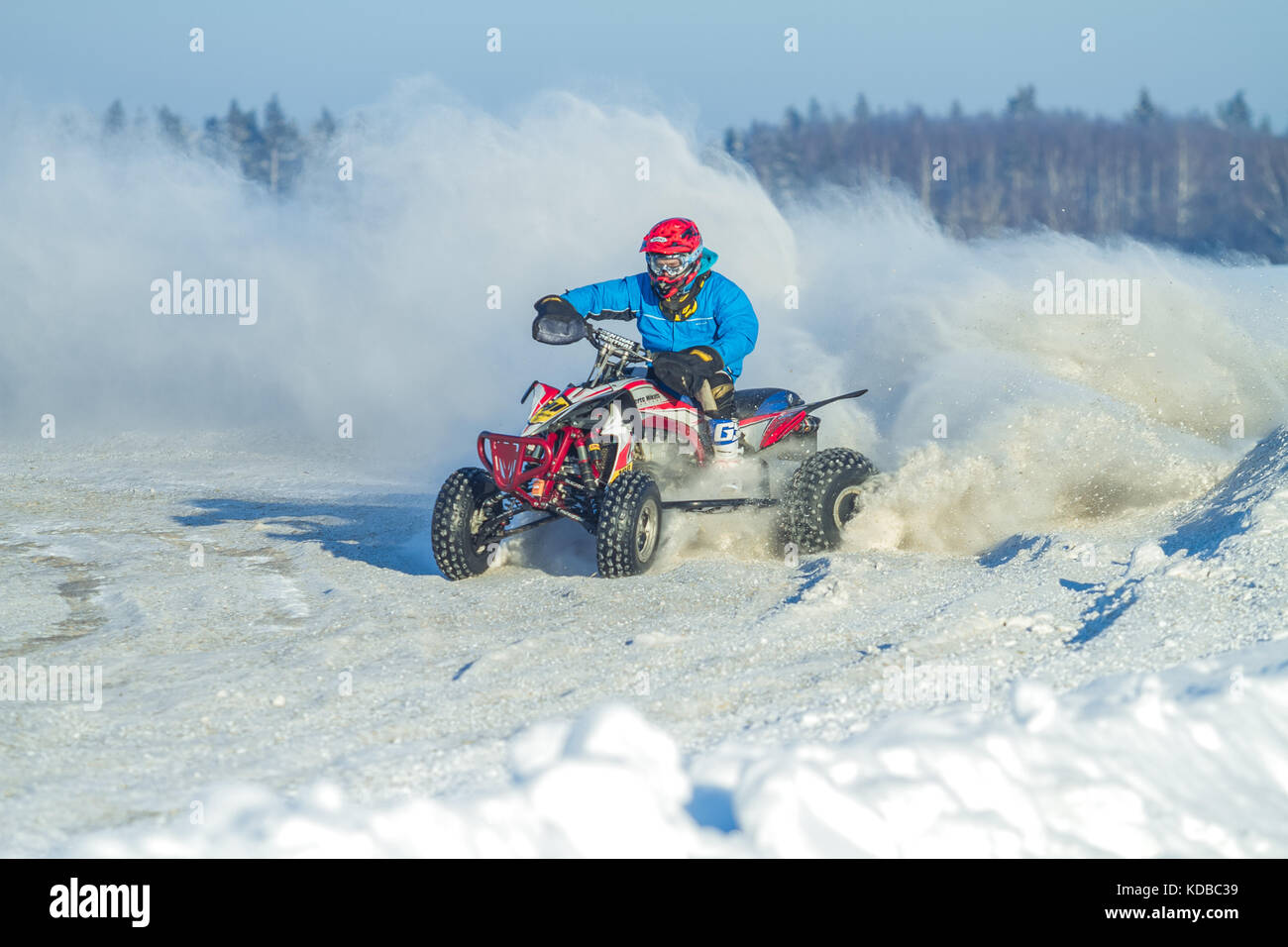 Latvia, Jaunrauna, Winter motocross, Driver with quadracycle, race. 2013 Stock Photo