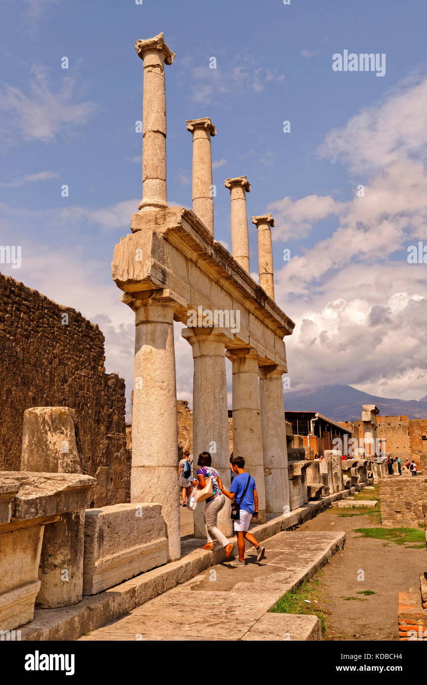 Arcadian way with doric columns at the Forum in the ruined Roman city of Pompeii at Pompei Scavi near Naples, Italy. Mount Vesuvius in the distance. Stock Photo