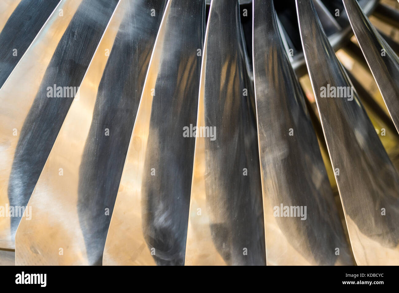 Closeup of aircraft engine fan blades with warm light Illumination