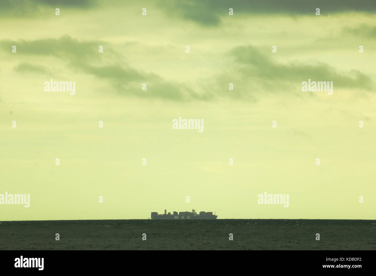 Ship on horizon Stock Photo - Alamy