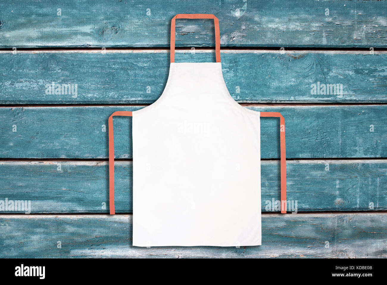 White apron on blue Stock Photo - Alamy