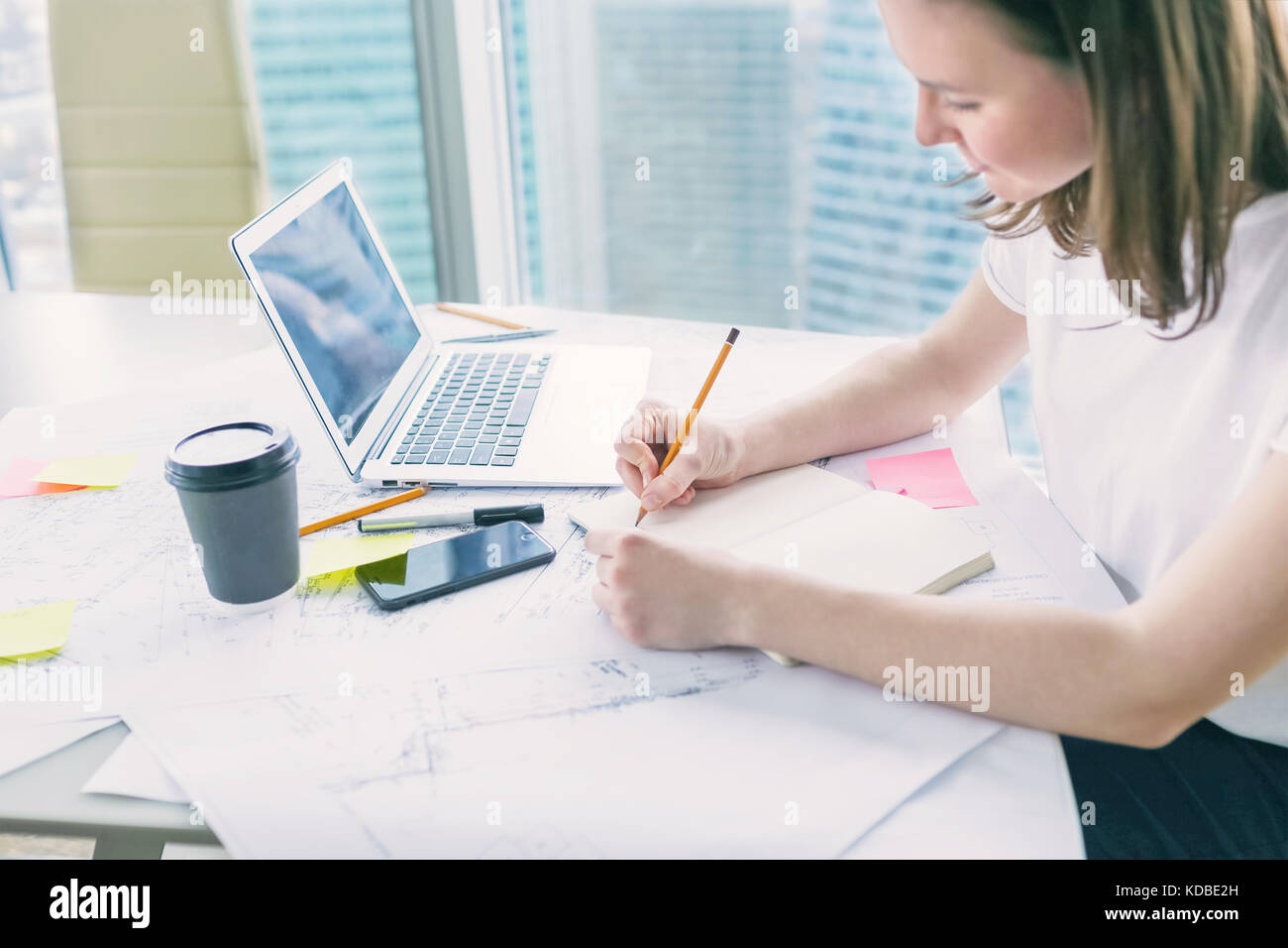 Young woman making notes Stock Photo