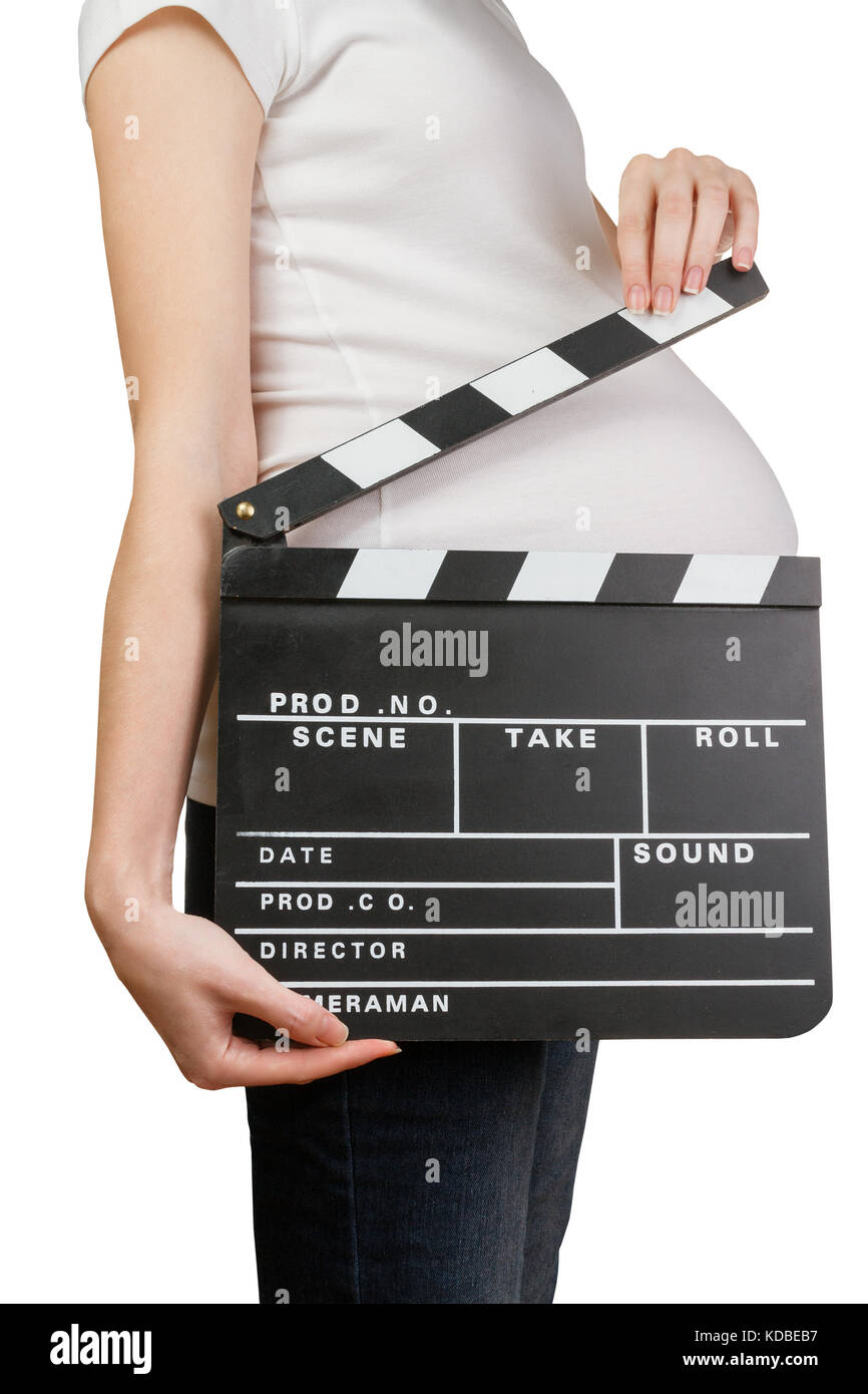 Pregnant woman holding clapperboard Stock Photo