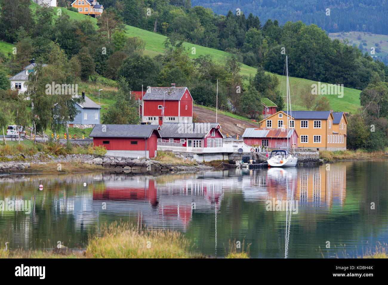 Houses and farms on the side of the Nordfjorden fjord near the village of Olden in Norway Stock Photo