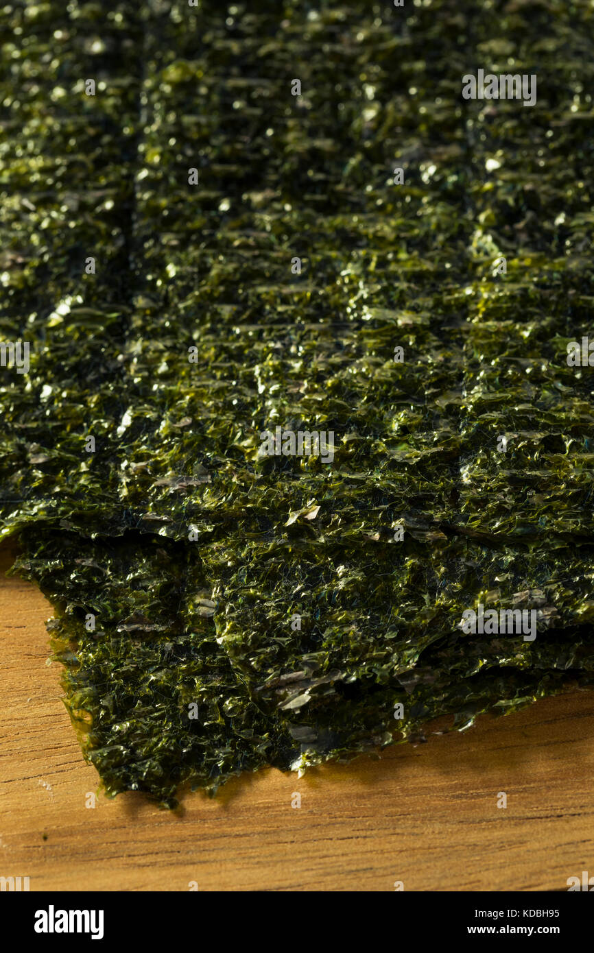 Organic Green Dry Roasted Seaweed Sheets on a Board Stock Photo Alamy
