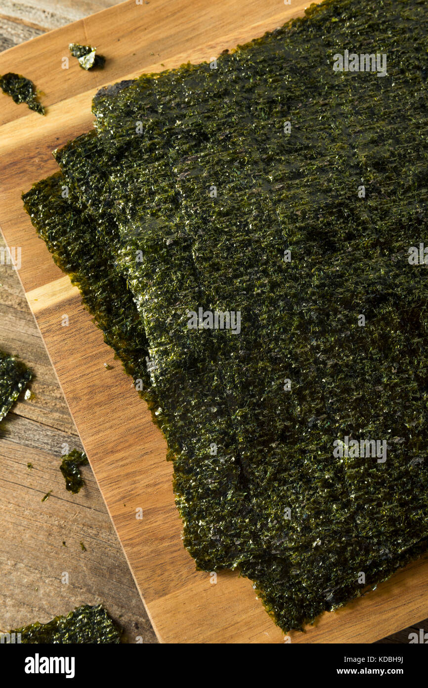 Organic Green Dry Roasted Seaweed Sheets on a Board Stock Photo Alamy