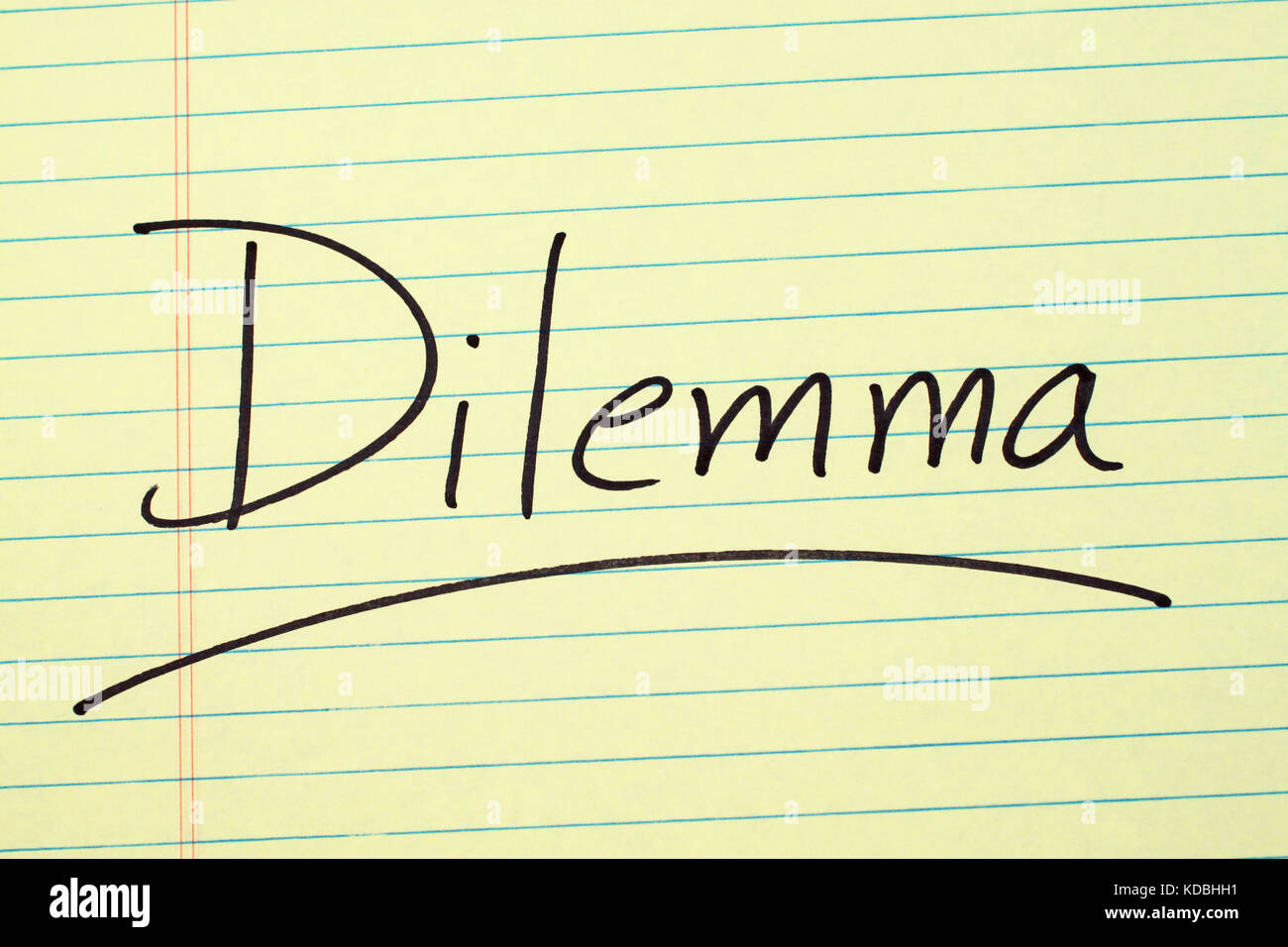 The Word Dilemma Underlined On A Yellow Legal Pad Stock Photo Alamy