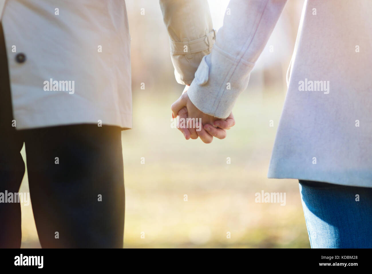 Teen couple walking holding hands hi-res stock photography and images ...
