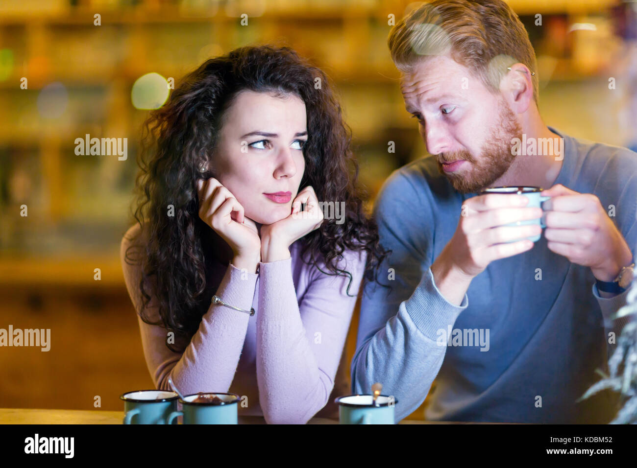 Young attractive couple having problems on date Stock Photo