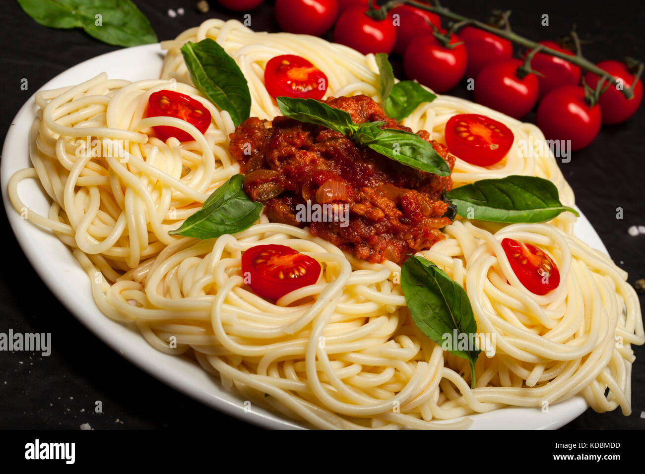 Closeup Of Delicious Spaghetti Bolognaise Or Bolognese With Savory Minced Beef And Tomato Sauce Garnished With Parmesan Cheese And Basil Stock Photo Alamy