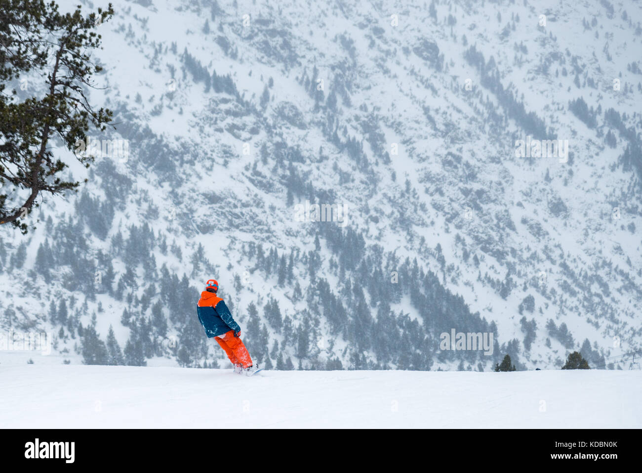 Skier on a snowboard in the mountains of Ordino in Andorra Stock Photo
