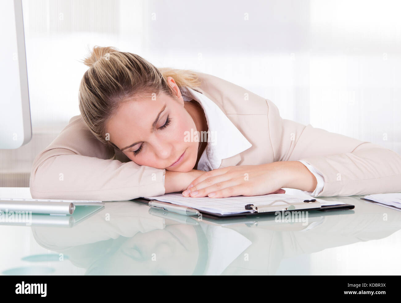 Exhausted Young Businesswoman Sleeping At Her Workplace Stock Photo - Alamy