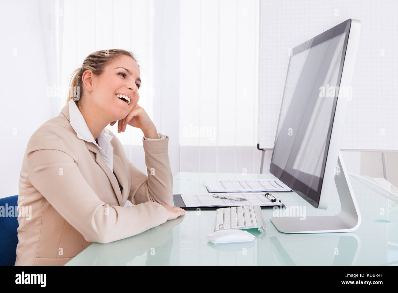 Portrait Of Young Businesswoman Using Computer In The Office Stock ...