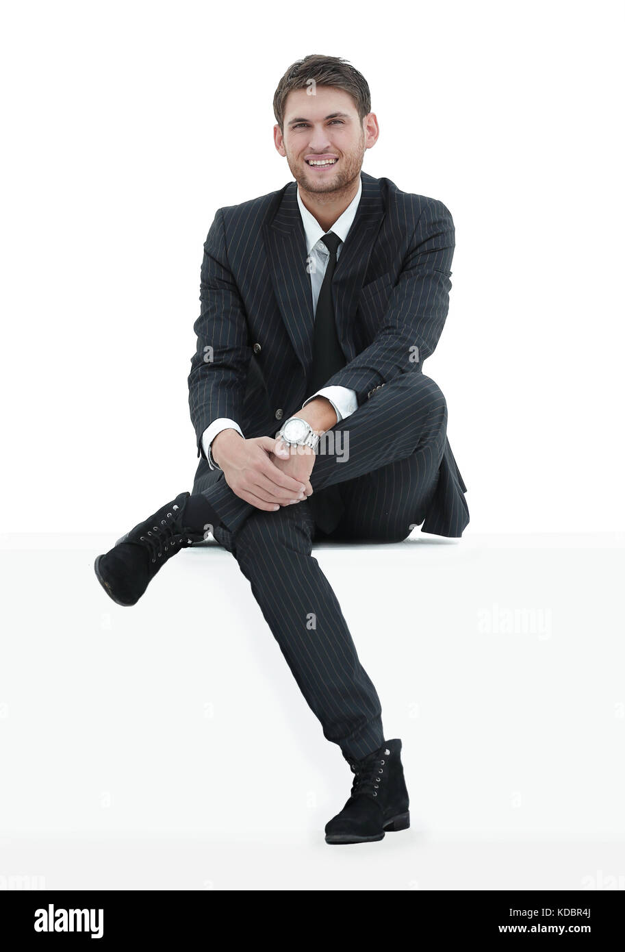 portrait relaxed businessman sitting Stock Photo - Alamy