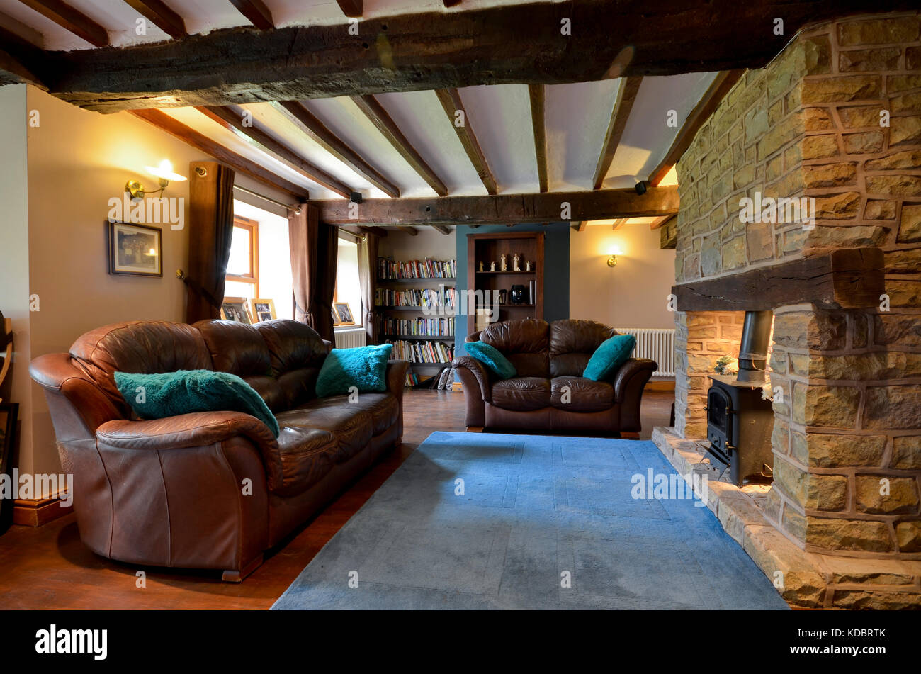 cosy farmhouse lounge with wood burning stove Stock Photo