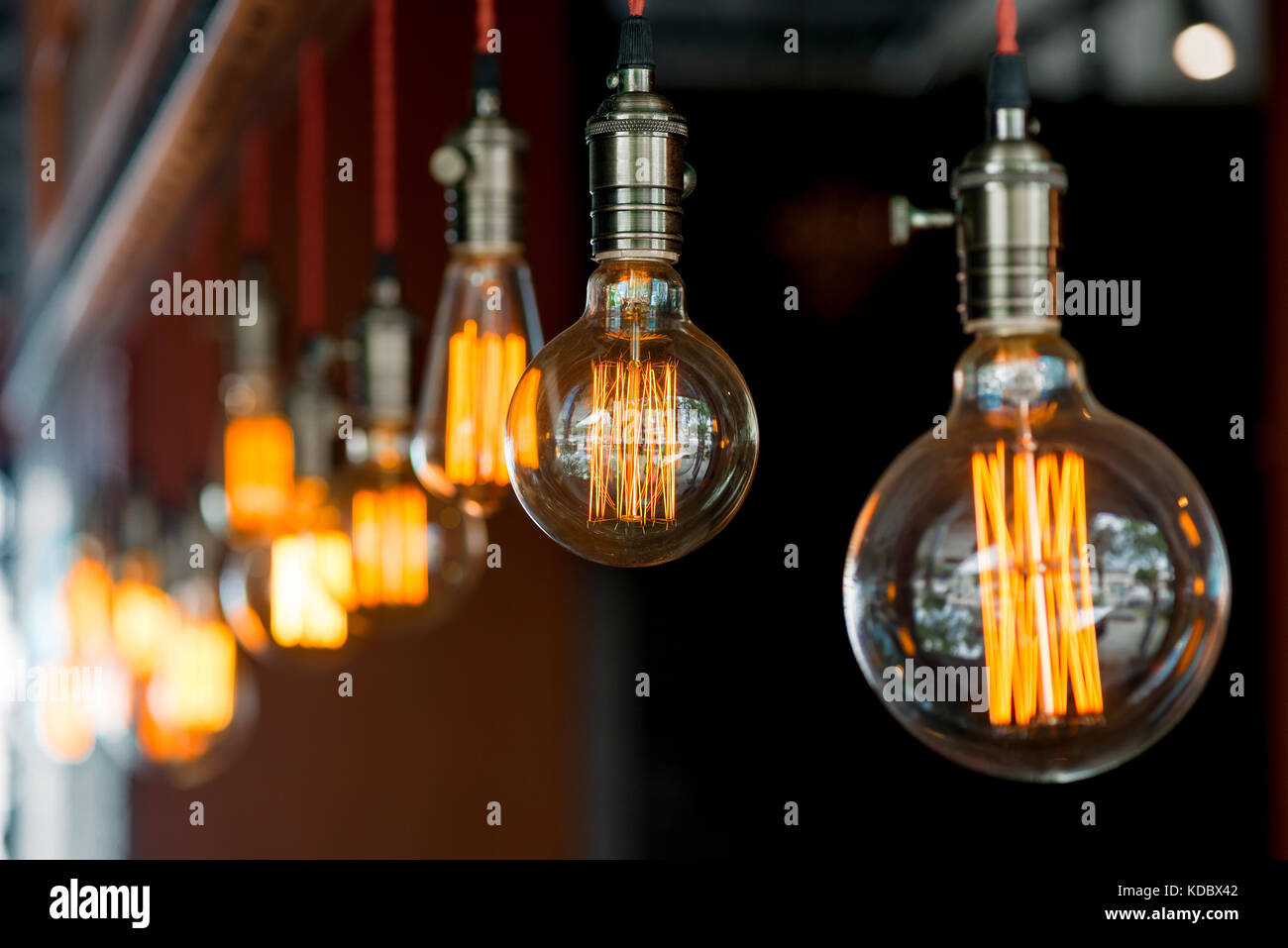 light bulb hanging from the ceiling in a retro style closeup in