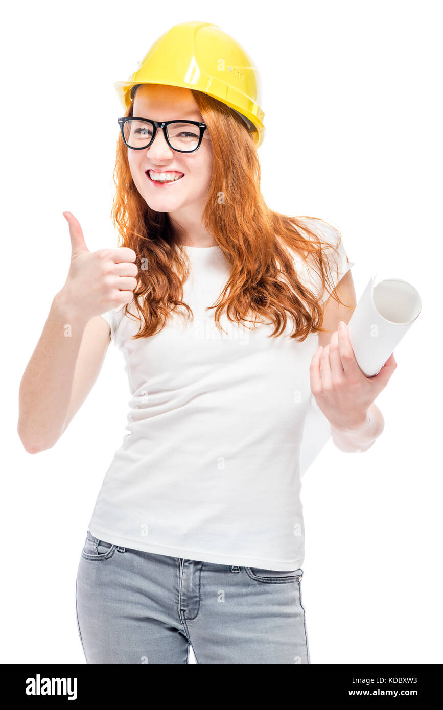 beautiful girl in a white T-shirt with blueprints is wearing a yellow hard ha Stock Photo