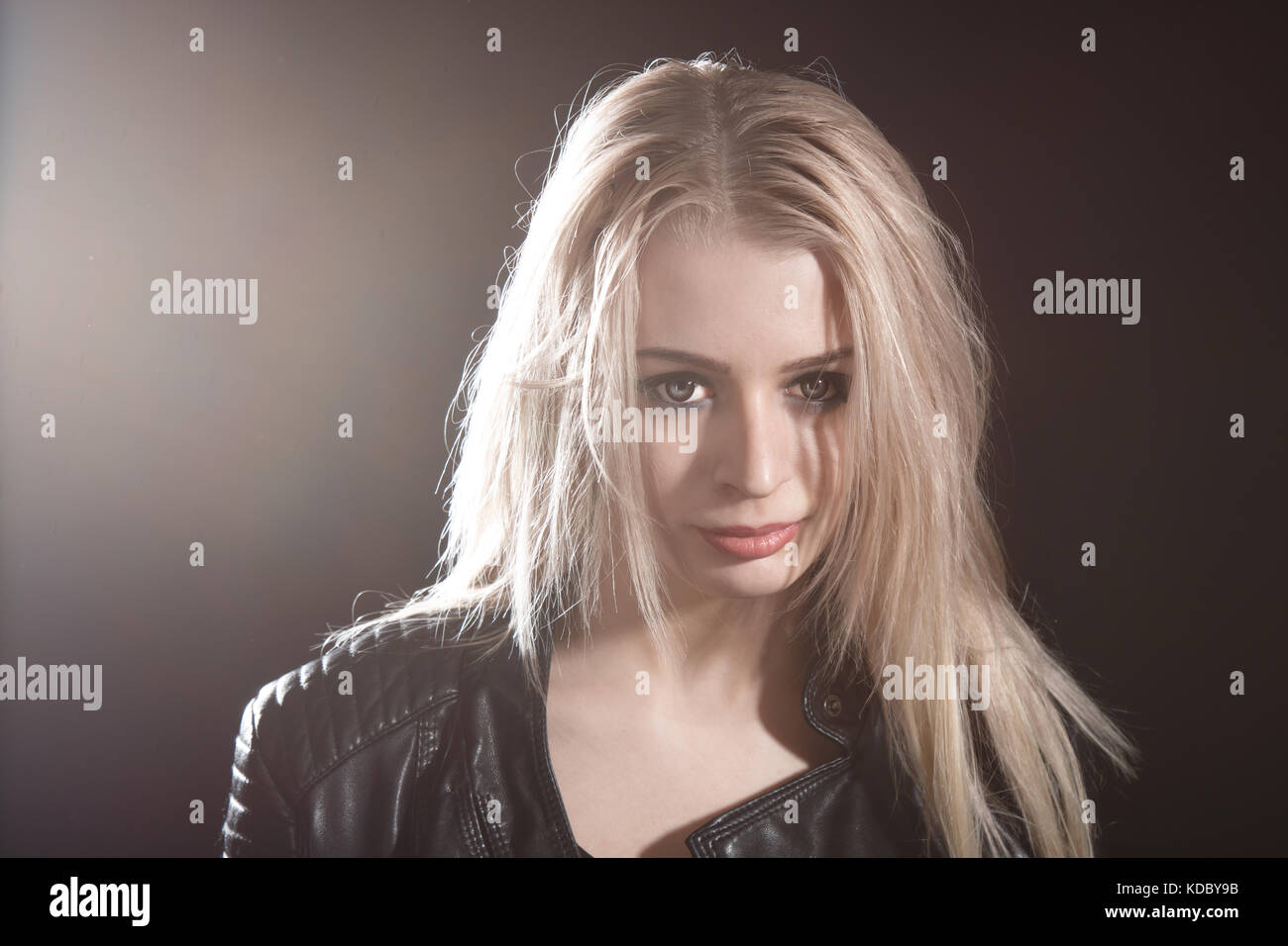 Portrait of a pretty young girl over black background Stock Photo - Alamy
