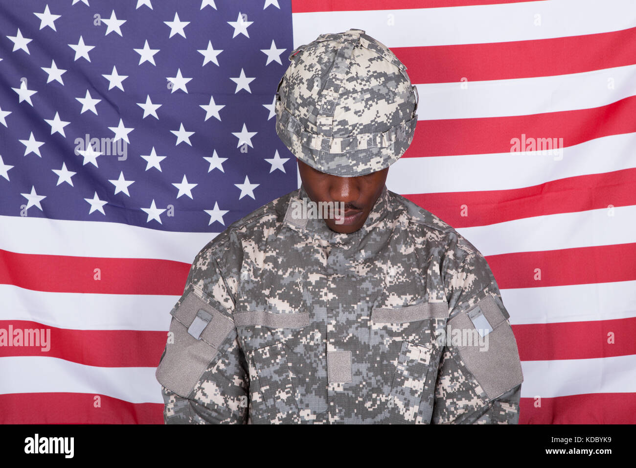 Portrait Of Afro-american Army Soldier Standing In Front Of American Flag Stock Photo