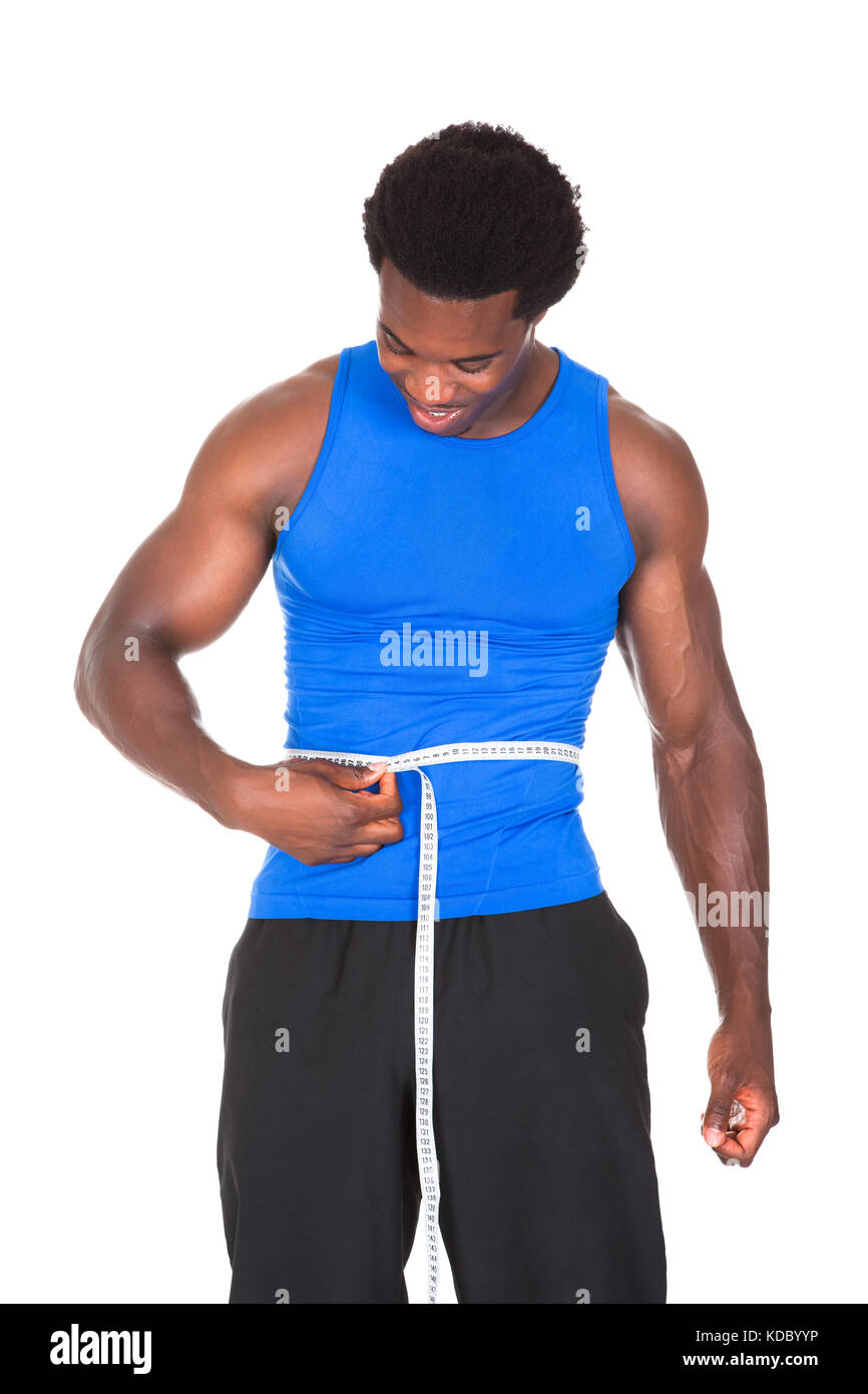 Muscular Man Measuring Waistline Stock Photo by ©AndreyPopov 97934424