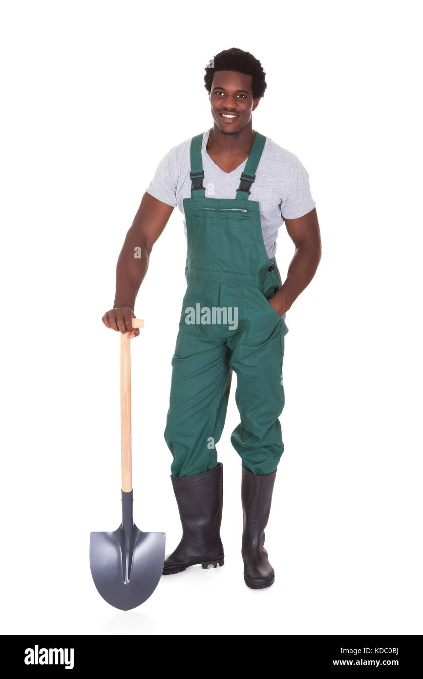 Happy Male Gardener Holding Shovel Over White Background Stock Photo ...