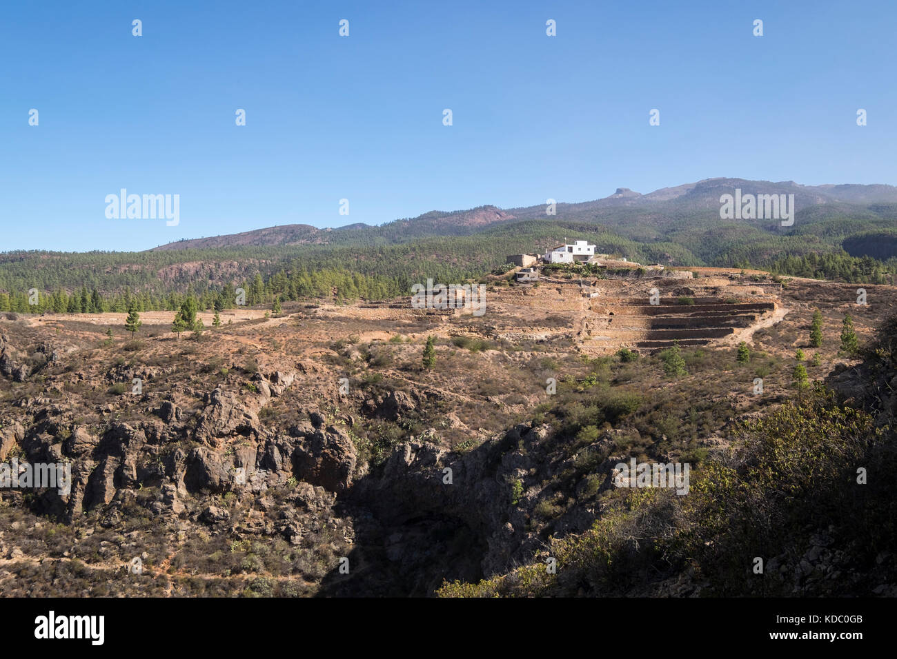 Isolated white farmhouse, finca, and terraces in Ifonche on the edge of the Barranco de los Fuentes, Adeje, Tenerife, Canary Islands, Spain Stock Photo